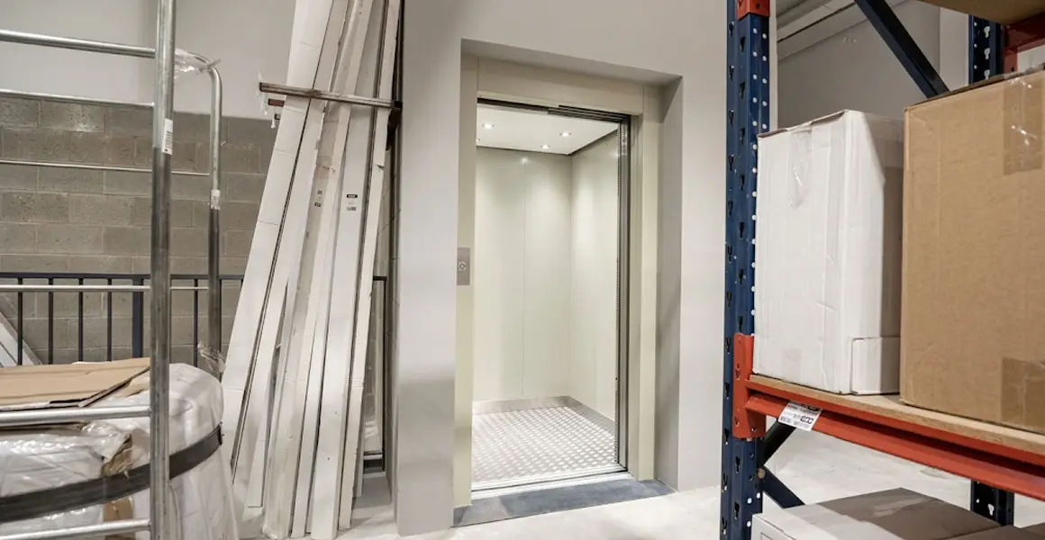 Elevator cabin during installation in a construction site in Riyadh with materials and equipment for new elevator fitting.